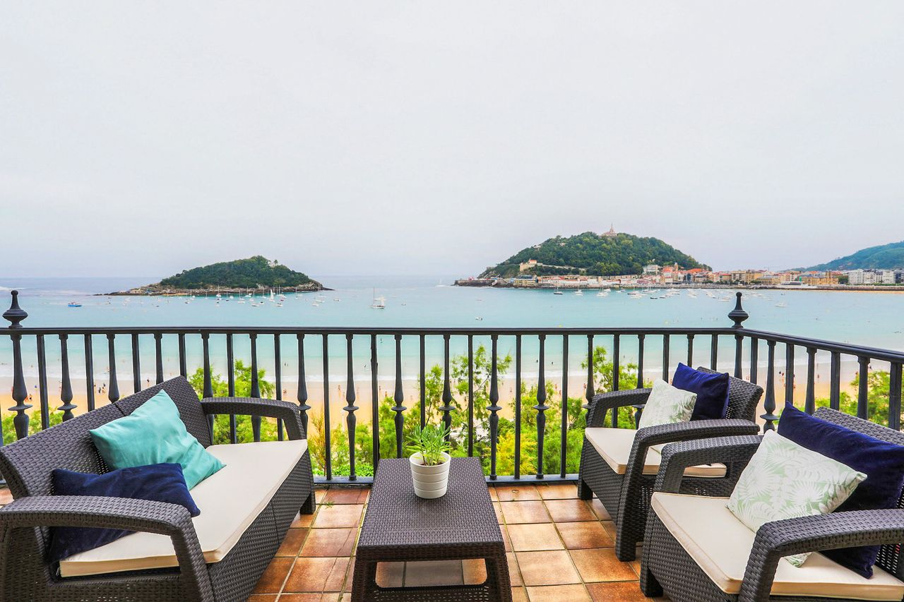 Stylish terrace overlooking San Sebastiáns La Concha Bay, perfect for relaxation.